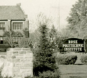 Historical black and white photo from the front entrance to campus