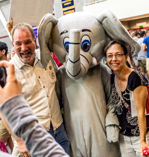 Parents posing with Rose-Hulman mascot, Rosie the Elephant