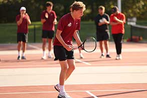 Tennis player getting ready to hit the ball.