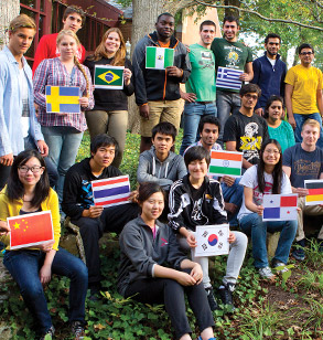 International students holding flags from their countries.
