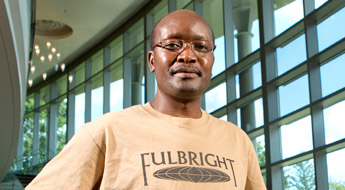 !Image shows a professor wearing a Fulbright Scholar T-Shirt in Hatfield Hall.