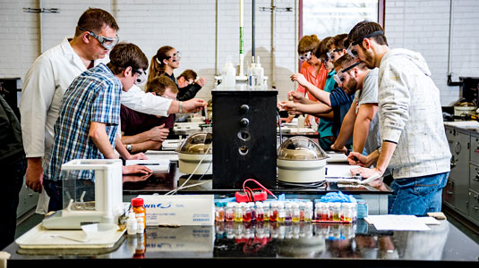 Students work on an experiment in a chemistry lab.