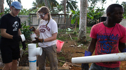 Students work on site to bring sanitation to a remote village.