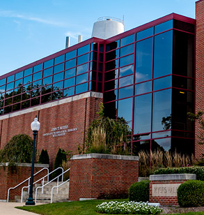 ! Blue sky reflecting off the glass windows making up the front of Myers Hall.