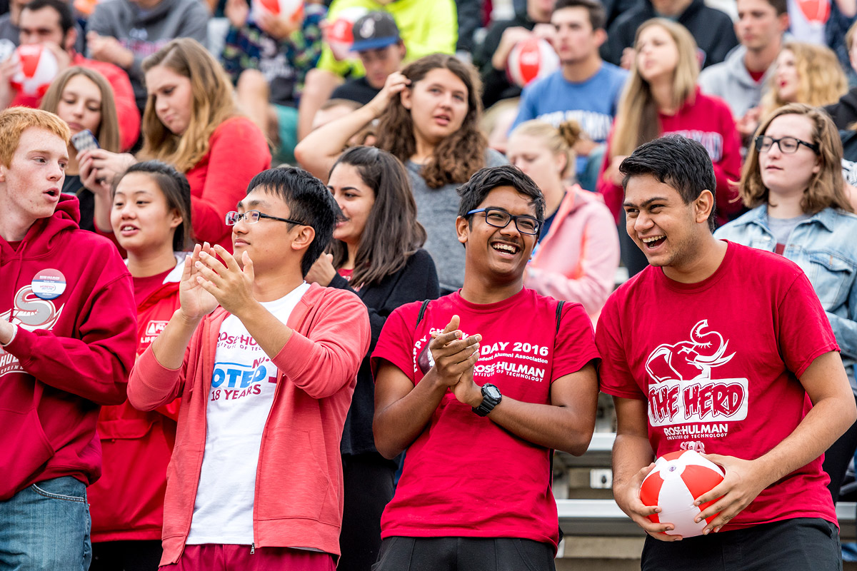 Students having fun in the stands during the football game