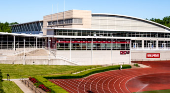Outside view of the Sports and Recreation Center showing a portion of the William Welch Track and Field track.