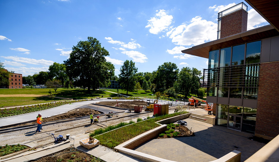Workers preparing the site of a new circle drive near the union building.