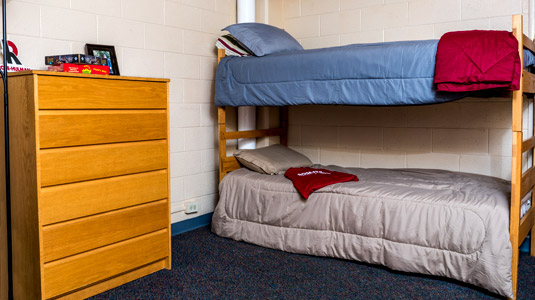 Bunk beds and dresser in a room in BSB Hall.