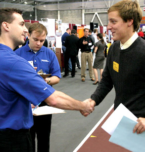 Student meets with company recruiters at Career Fair.