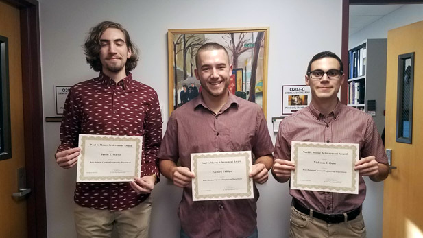 Students holding awards.