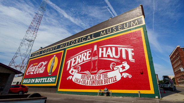 A three-story-high mural recognizing Terre Haute as the "Birthplace of the Coca-Cola Bottle." 
