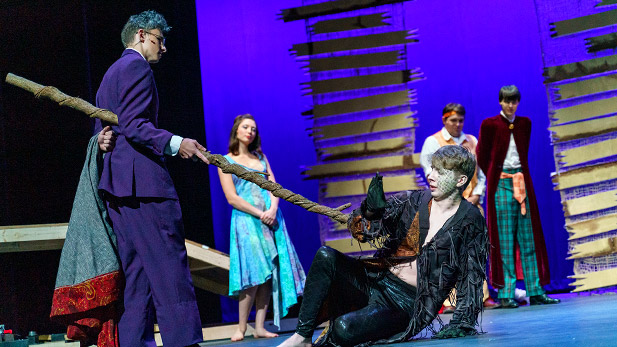Students performing on stage during The Tempest