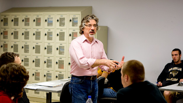Richard Layton teaching a classroom of students.