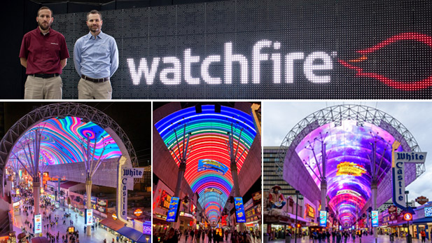 Michael Cox and Scott Ohlmiller stand by a lighted sign reading "Watchfire Signs" along with images of the lighted canopy over Fremont Street.
