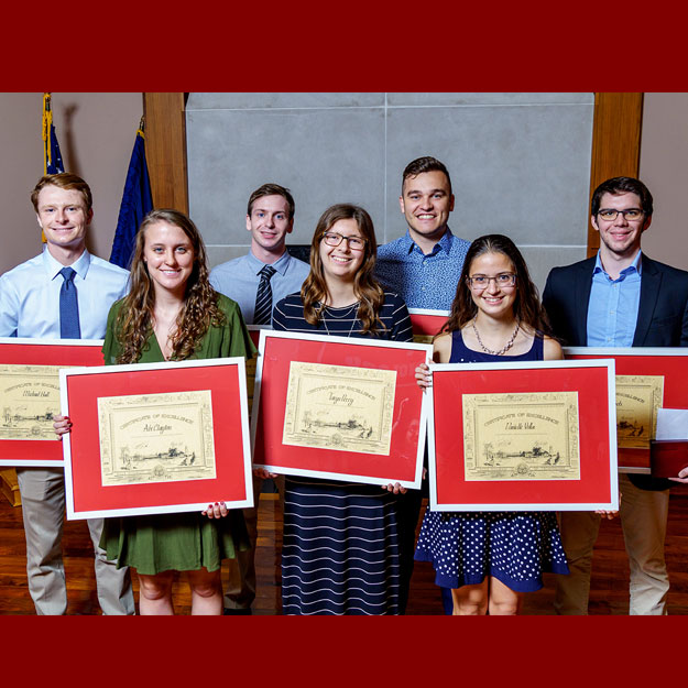 Rose-Hulman students holding their academic awards.