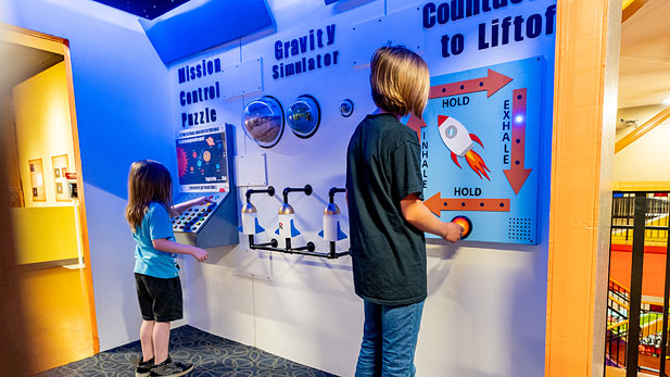 Children exploring new space station exhibit at the Terre Haute Children's Museum