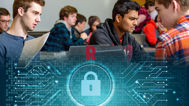 students look at their computer screens in class.