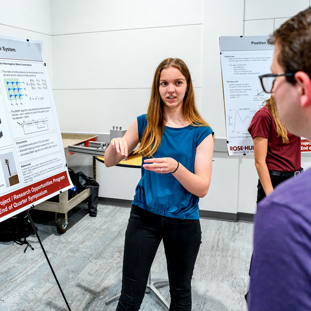 Rose-Hulman student gives a poster presentation at the Rose Research Fellows symposium.