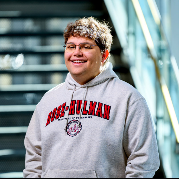 Heath Doll wears a grey Rose-Hulman sweatshirt in Hatfield Hall.