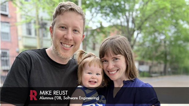 Mike Reust with his wife and toddler daughter.