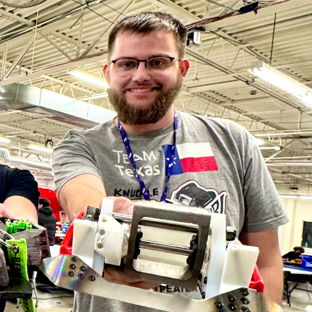 Peter Ganache shows off his combat robots.