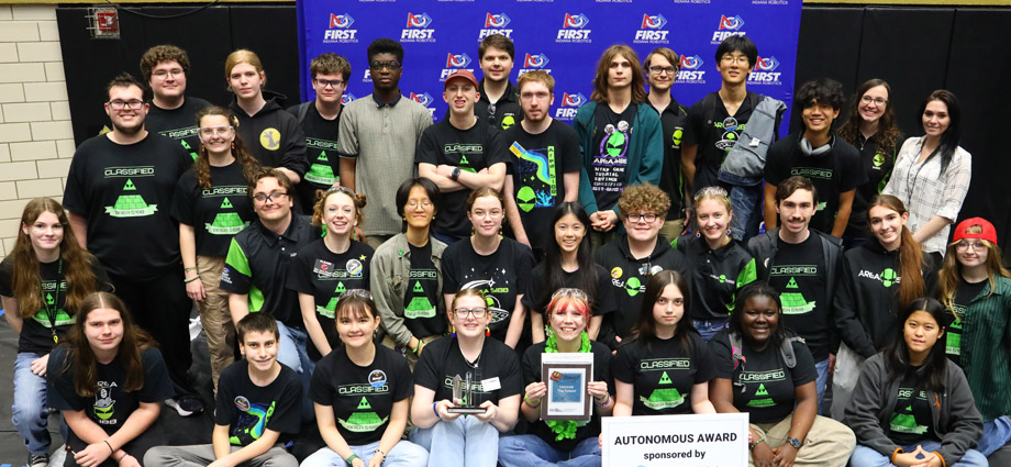 First Robotics students and mentors with their award.