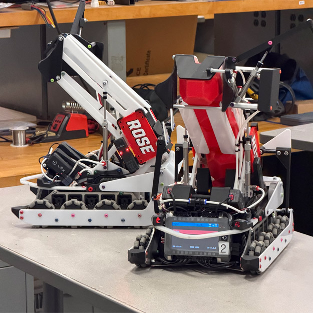 VEX U students and their robots at the World Championships.