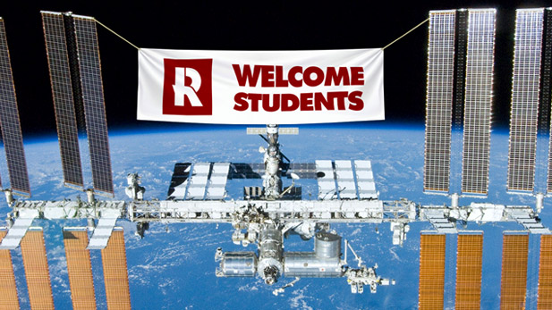 Mock photo of the International Space Station with a banner reading "Welcome Students"